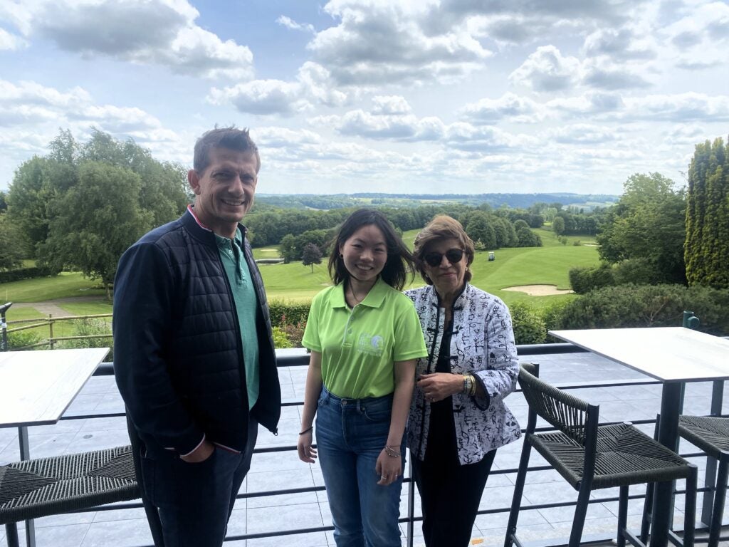 GU student with Farima Mostowfi and program director Nicolas Rochas in front of green landscape in Saint-Omer, France