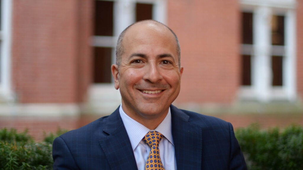 Andrew Sobanet in front of brick building