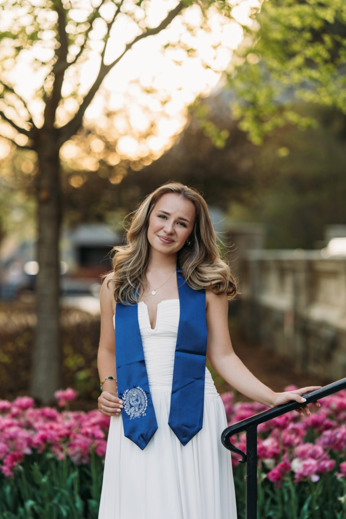 blond White woman in white dress with blue graduation stole